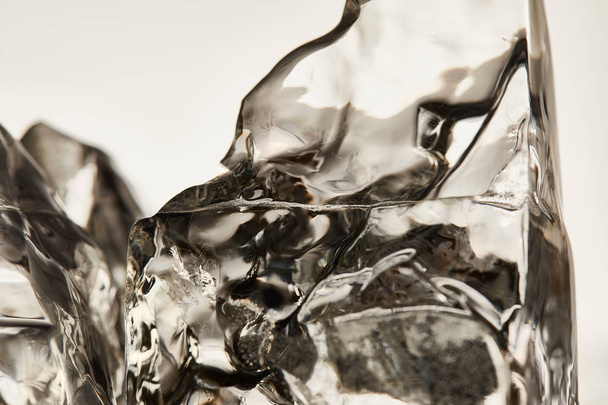 close up view of transparent ice cubes isolated on grey - Foto, immagini