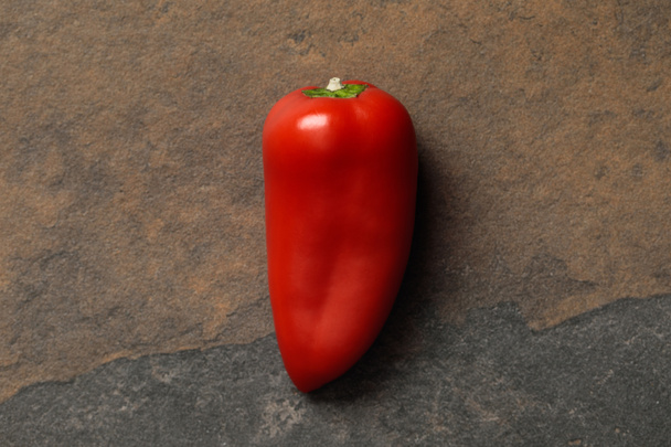 top view of Mexican spicy red pepper on stone table - Foto, afbeelding