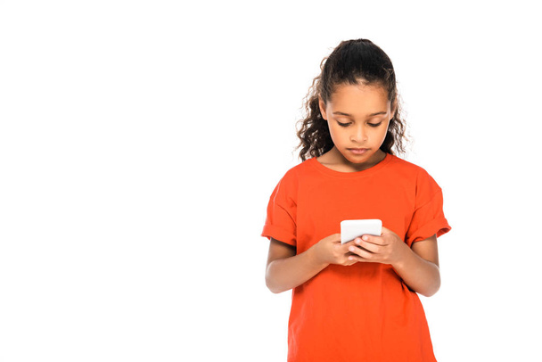 attentive african american kid using smartphone isolated on white with copy space - 写真・画像