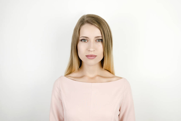 young charming blonde woman on isolated white background - Foto, afbeelding