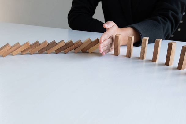 hand stop blocks wood game, gambling placing wooden block. Concept Risk of management and strategy plan, protect business to success - Photo, Image