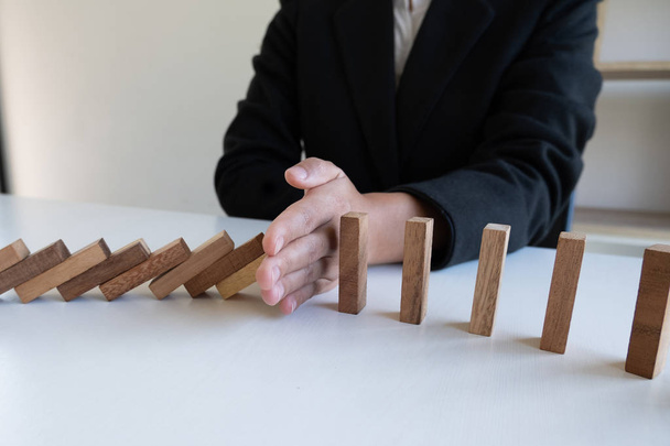 hand stop blocks wood game, gambling placing wooden block. Concept Risk of management and strategy plan, protect business to success - Photo, Image