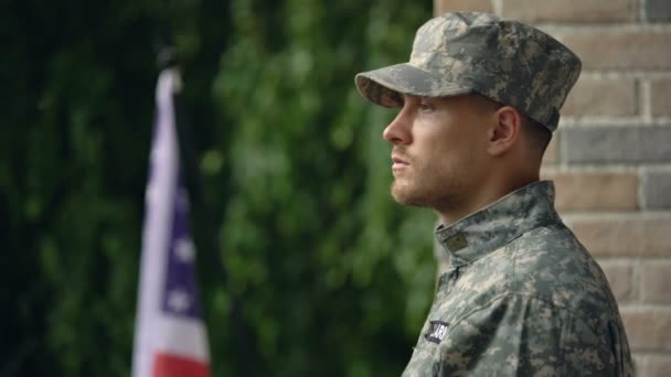 Pensive american military man looking at rain, suffering depression and ptsd - Filmagem, Vídeo
