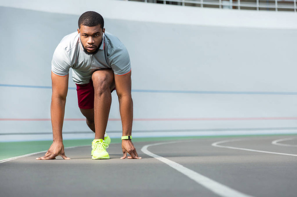 Determined young African American male athlete in sportswear - Fotoğraf, Görsel