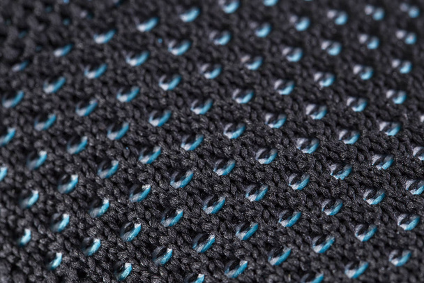 Fragmento de zapatilla de tela azul y negra. La textura del material de los zapatos deportivos
 - Foto, Imagen