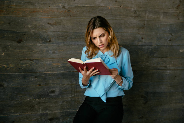 Beautiful business woman reading a book - Photo, image