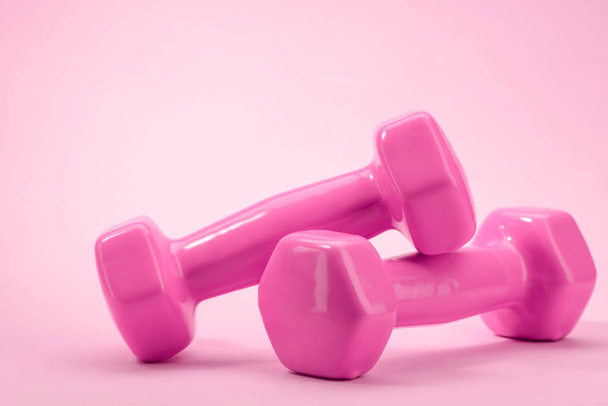 Pair of dumbbells on pink - Photo, Image