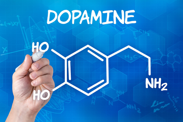 Mano con pluma dibujando la fórmula química de la dopamina
 - Foto, Imagen
