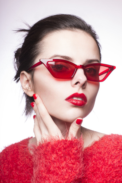 young woman in red sunglasses, red nails, red lipstick - Zdjęcie, obraz