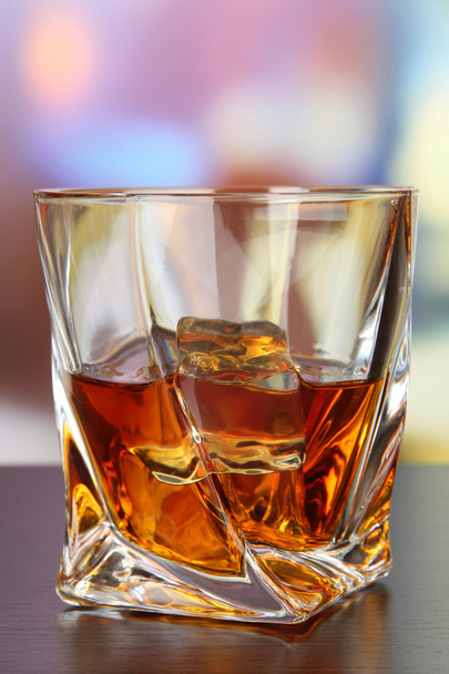 Glass of whiskey, on bright background - Foto, Imagem