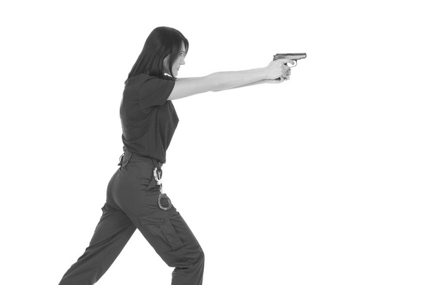 jonge politie meisje met pistool - Foto, afbeelding
