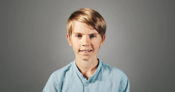 Smiling Boy Isolated On Grey Portrait - Felvétel, videó