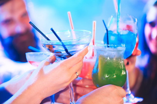 Friends with cocktails drinks at a party. - Fotó, kép