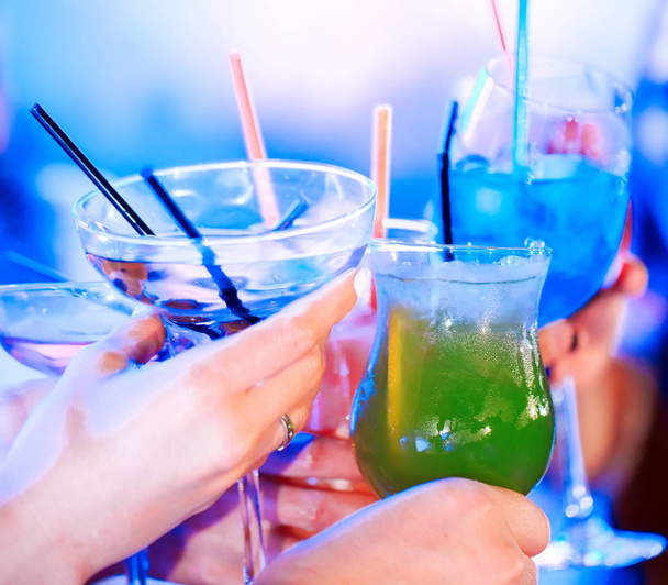 Friends with cocktails drinks at a party. - 写真・画像