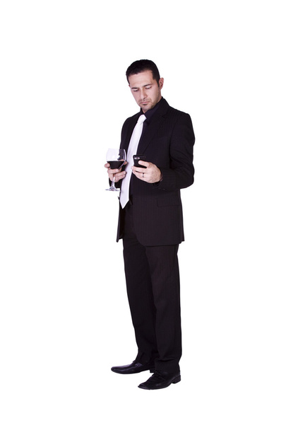 Businessman with a glass of drink - Фото, зображення