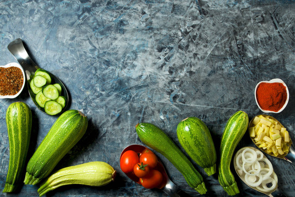 Vegetables on the background. Fresh vegetables (cucumbers, tomat - Фото, зображення