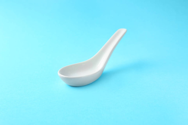 Clean Miso soup spoon on blue background - Zdjęcie, obraz