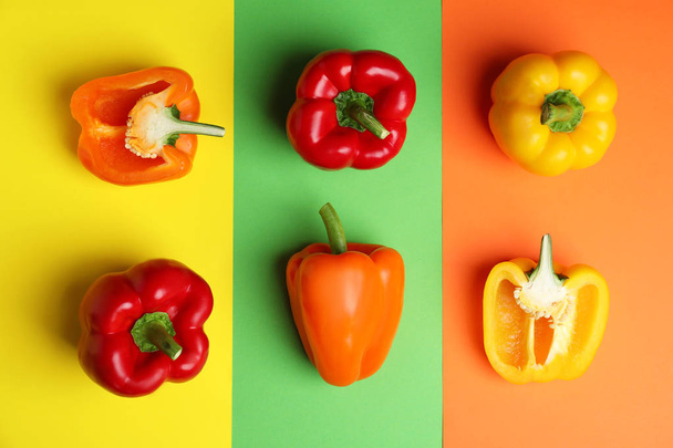 Flat lay composition with ripe bell peppers on color background - Фото, зображення