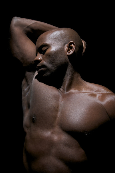 Bodybuilder relaxes and concentrate before starting his excersite routine. - Photo, Image