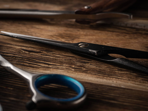 the barber shops tools on wooden desk. - Фото, изображение