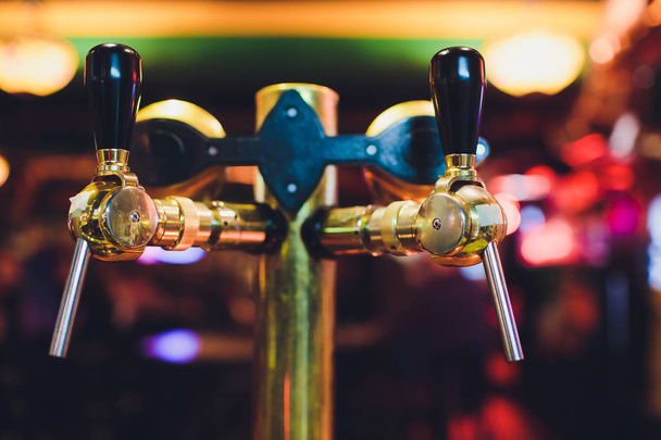 Close up of beer taps in row. Metallic equipment for bars and mini brewerys. Concept of modern equipment. - Φωτογραφία, εικόνα