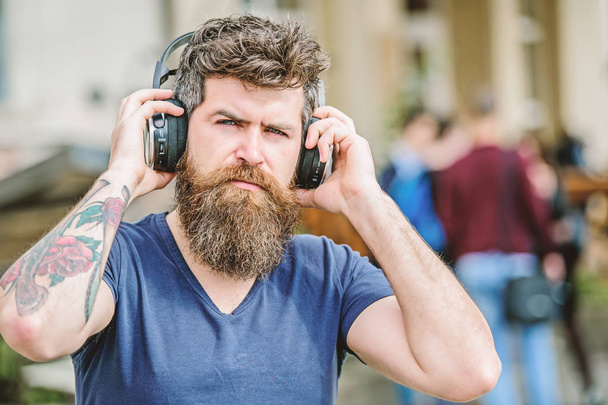 Hipster enjoy excellent sound song in earphones. Excellent music playlist. Walking with music. Music beat for energetic mood. Rhythm for walk. Man bearded hipster headphones listening music - Φωτογραφία, εικόνα