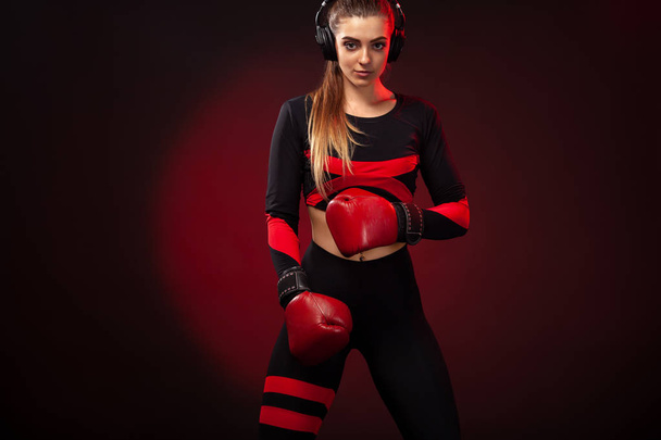 Young woman sportsman boxer on boxing training. Girl wearing gloves, sportswear. - Φωτογραφία, εικόνα