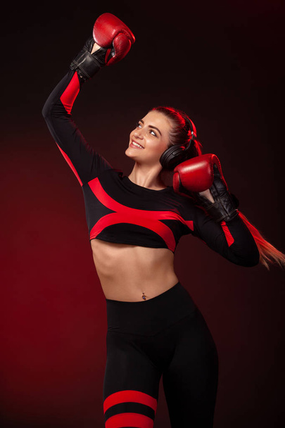 Young woman sportsman boxer on boxing training. Girl wearing gloves, sportswear. - Fotografie, Obrázek