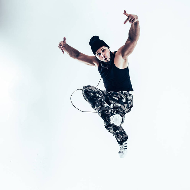 young rapper dancing break dance .photo on a white background. - 写真・画像