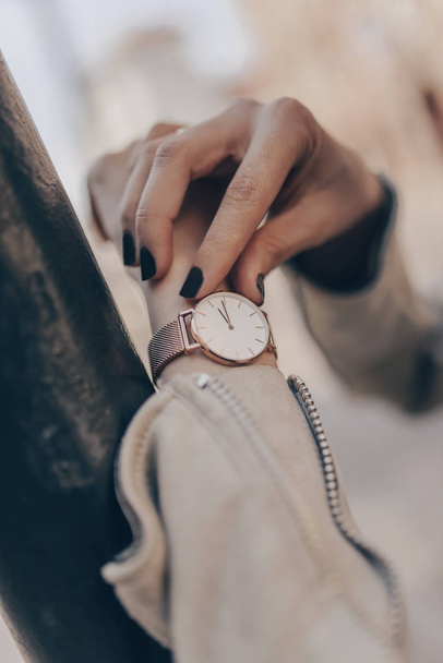 Stylish golden watch on woman hand - Φωτογραφία, εικόνα