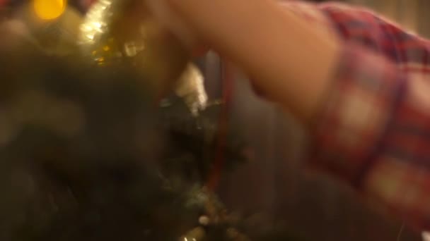 Cropped Shot Of Kid Decorating Christmas Tree - Felvétel, videó