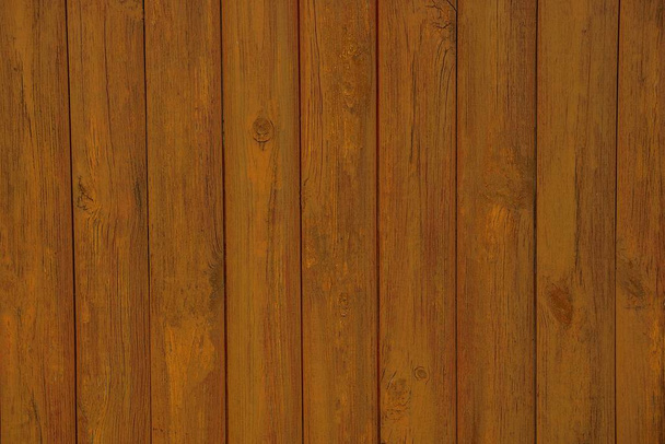  brown wooden texture of the boards in the wall of the fence - Fotoğraf, Görsel