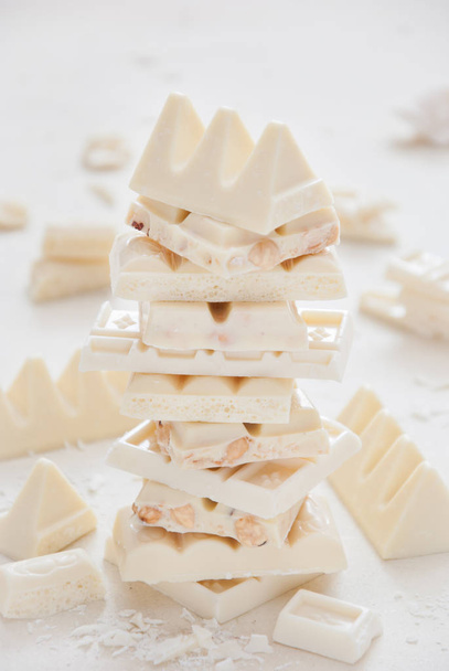 Stack of different white chocolate on a light background - Foto, immagini