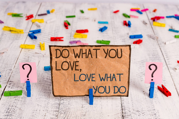 Conceptual hand writing showing Do What You Love Love What You Do. Business photo text you able doing stuff you enjoy it to work in better places then Crumbling sheet with paper clips placed on the - Photo, Image