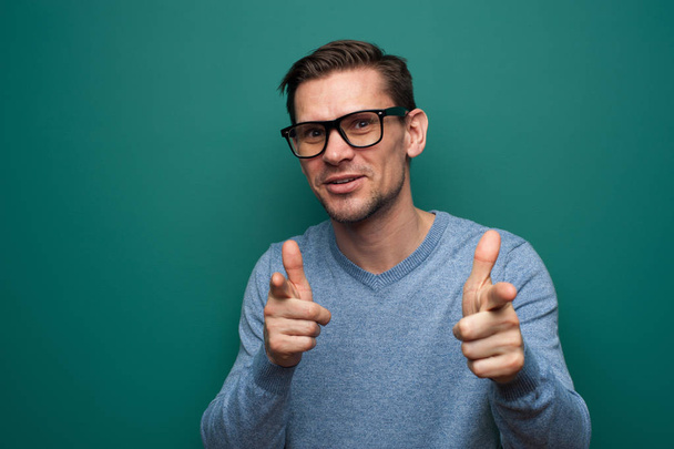 Portrait of a positive young man in glasses - Photo, image