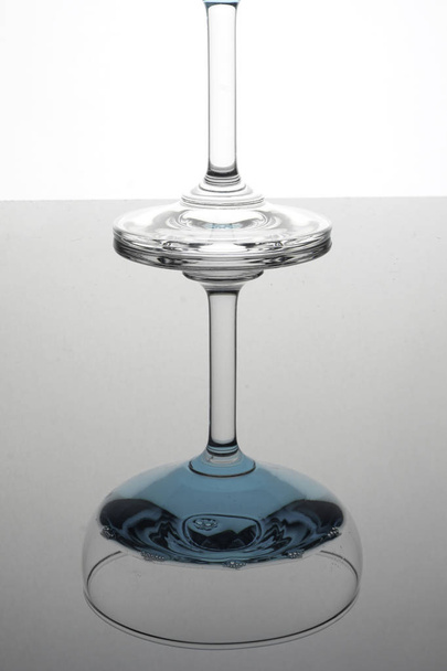 glass with blue liquid, studio shot with reflection  - Fotó, kép