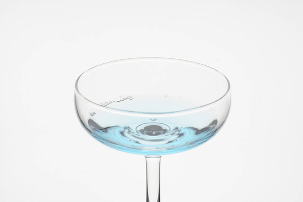 glass with blue liquid, studio shot on white background  - Foto, immagini