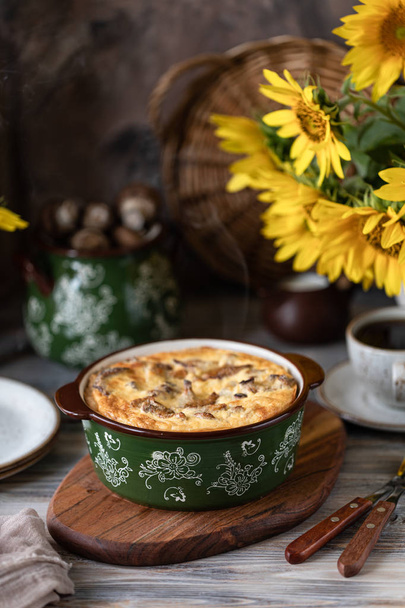 Quiche pie with mushrooms on a wooden table. - Photo, Image