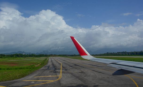 Airport runway with airplane wing  - Photo, Image