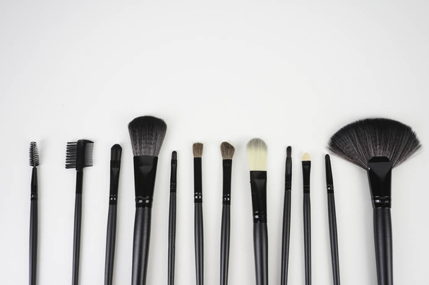 set of make up brushes over light background - Foto, Bild