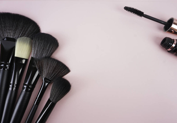set of black make up brushes over pink background - Foto, Bild