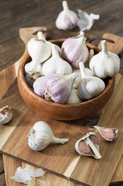 Garlic on a grey wooden table. Rustic style - Fotografie, Obrázek