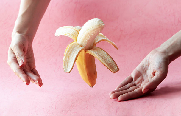 open and sliced banana floating isolated on white - Photo, Image