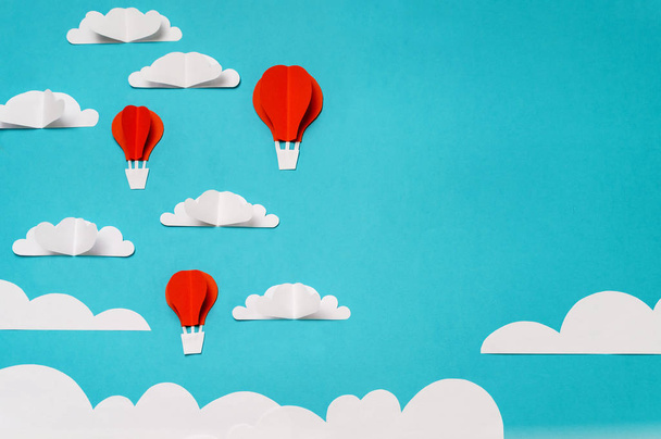 Creative concept for banner/landing/background designs with hot air balloons in clouds paper cut and origami objects. - Фото, изображение