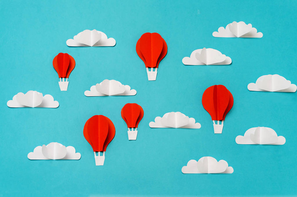 Hot air balloons in the sky paper cut and origami objects. Creative concept for banner/landing/background designs. - Foto, immagini