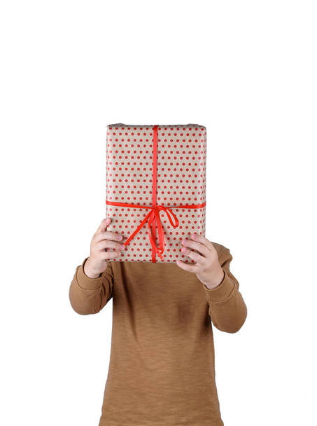 Holiday gifts in children's hands on a white background. - Zdjęcie, obraz