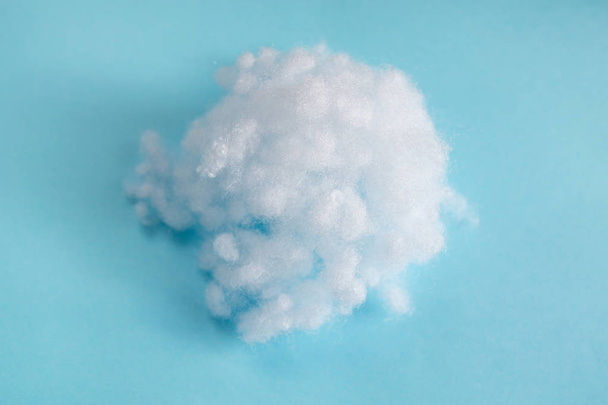white synthetic winterizer on blue background - Foto, Imagem