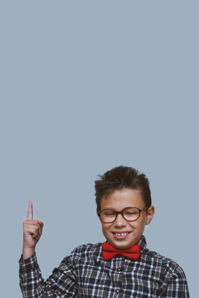 Young schoolchild pointing up portrait - Foto, Imagen