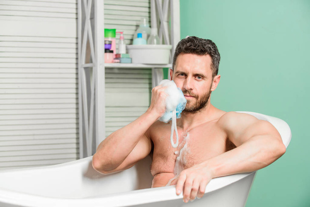 Regular bath have greater effect mood than physical exercise. Man attractive with sponge take bath. Personal hygiene. Take care hygiene. Personal grooming is cleaning parts body. Hygiene concept - Foto, Imagem