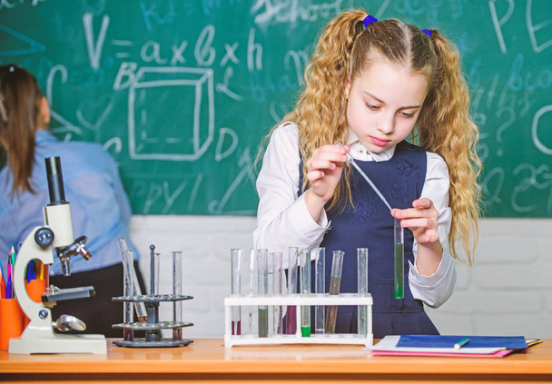Chemical analysis. School pupil study chemical liquids. School chemistry lesson. Test tubes with substances. Laboratory glassware. School laboratory. Girl smart student conduct school experiment - Zdjęcie, obraz